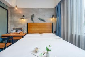 Katil atau katil-katil dalam bilik di Gongxili - Chujian Hotel