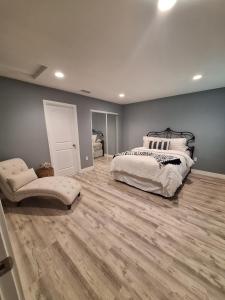 a bedroom with a bed and a wooden floor at My amazing home in Azusa