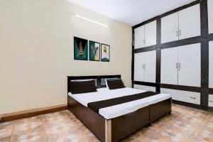 Ένα ή περισσότερα κρεβάτια σε δωμάτιο στο Hotel O Gracious Inn