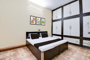 Ένα ή περισσότερα κρεβάτια σε δωμάτιο στο Hotel O Gracious Inn