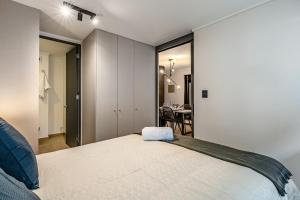 Uma cama ou camas num quarto em Corazón Stgo Estilo Puro