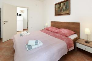 Postel nebo postele na pokoji v ubytování Apartmani Svoboda