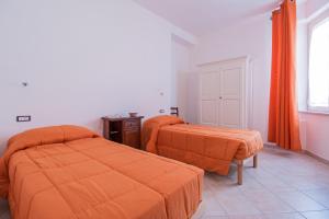 Postel nebo postele na pokoji v ubytování Pedrales Orgosolo