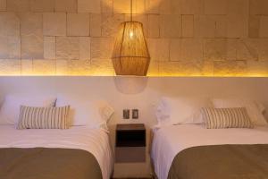 Postel nebo postele na pokoji v ubytování Traspatio Hotel Boutique