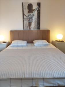 Postel nebo postele na pokoji v ubytování Apartments Mato