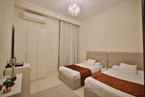 Voodi või voodid majutusasutuse Sphinx House toas