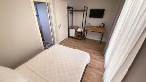 Postel nebo postele na pokoji v ubytování Sahil Butik Otel