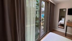 Postel nebo postele na pokoji v ubytování Sahil Butik Otel