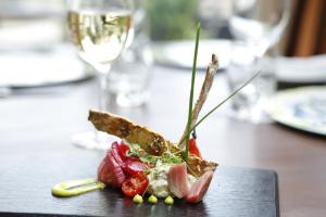 a plate of food on top of a table at Park Central Hotel in Bournemouth