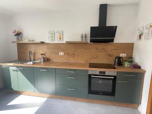 Η κουζίνα ή μικρή κουζίνα στο Nordsee Ferienwohnung Kolschen
