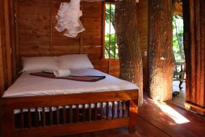 מיטה או מיטות בחדר ב-Tree House-Midigama