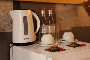 a coffee maker sitting on top of a refrigerator at Kayanberd Resort in Alaverdi