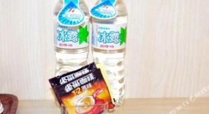 two bottles of water sitting on top of a table at JinJiang Inn Nanchang Bayi Square Ximazhuang Food Street in Nanchang