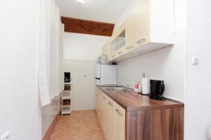 Kuchyň nebo kuchyňský kout v ubytování Apartmani Svoboda