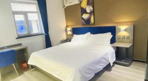 Katil atau katil-katil dalam bilik di 7 Days Inn Baoding Railway Station