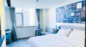Katil atau katil-katil dalam bilik di 7 Days Inn Baoding Railway Station