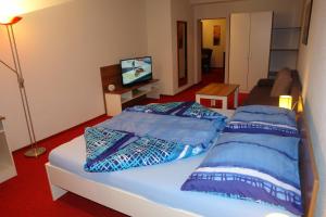 Ein Bett oder Betten in einem Zimmer der Unterkunft Hotel Garni Daniela Urich