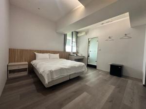 Posteľ alebo postele v izbe v ubytovaní Xingyi Hotel