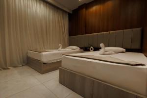 Postel nebo postele na pokoji v ubytování City Hotel + 13 fotografií