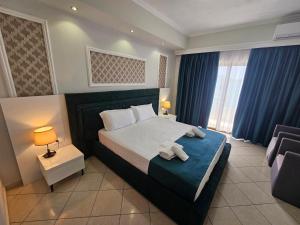 Postel nebo postele na pokoji v ubytování Hotel Pini