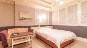Postel nebo postele na pokoji v ubytování Tabist Hotel Please Kobe