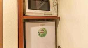 Kuchyň nebo kuchyňský kout v ubytování Tabist Hotel Please Kobe