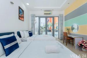 Postel nebo postele na pokoji v ubytování Villages Bãi Sau Vũng Tàu OCEAN 24 Gần Biển + 29 fotografií