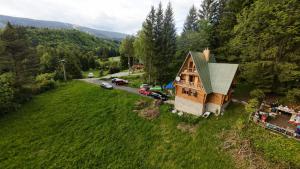 an aerial view of a house in the middle of a field at RETRO CHATA Kubínska in Dolný Kubín