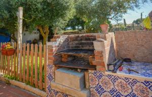 a brick oven in a yard next to a fence at Pet Friendly Home In Ragusa With Wifi in Ragusa +17 photos