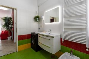 a bathroom with a sink and a washing machine at Trbović Apartments Peaceful stay with Free Parking, Pet-Friendly, and Bike Storage in Umag in Umag +44 photos