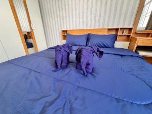 Postel nebo postele na pokoji v ubytování Tropikathu Guest House