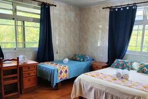Ένα ή περισσότερα κρεβάτια σε δωμάτιο στο Raiatea Guest