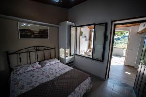 Postel nebo postele na pokoji v ubytování Residenza La Grazia Tropea - Free Parking -