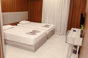 Royal Home Hotel房間的床