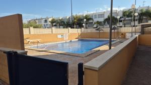 a swimming pool on the side of a building at La Isla Bonita in Daimuz