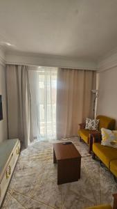 a living room with a couch and a table at Padmore Residences - B1506 in Nairobi