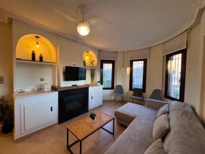 a living room with a couch and a table at Maikran Premium Fantastic Family Villa with Pool in San Fulgencio