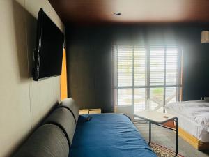 Postel nebo postele na pokoji v ubytování SIMA inn