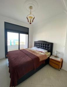 Giường trong phòng chung tại Assilah, briech logement vue sur mer
