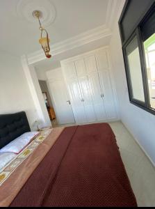Giường trong phòng chung tại Assilah, briech logement vue sur mer