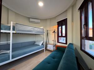 a living room with a couch and bunk beds at Maikran Premium Fantastic Family Villa with Pool in San Fulgencio +41 photos