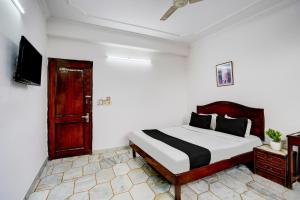 Postel nebo postele na pokoji v ubytování Hotel O Iconic Residency