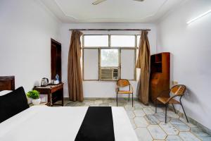 Postel nebo postele na pokoji v ubytování Hotel O Iconic Residency + 23 fotografií