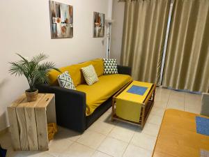 A seating area at Apartamento Mi casa tu casa