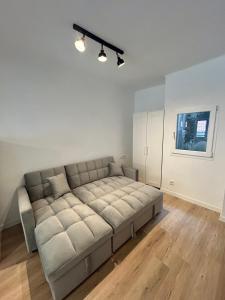 a living room with a large couch in a room at Del Valle 2 in Cudillero