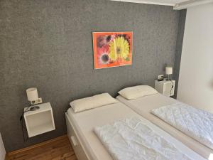 Ένα ή περισσότερα κρεβάτια σε δωμάτιο στο Ferienwohnung Ortlieb