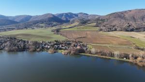 an aerial view of a lake with mountains in the background at Villa GARFIELD NITRIANSKE RUDNO in Nitrianske Rudno +4 photos