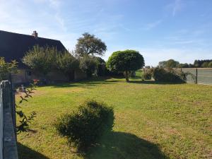 a shadow of a person standing in a yard at L'endurance 24 in Teloché +3 photos