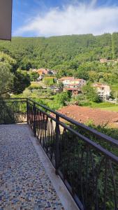 a balcony with a view of a city at Appartamento Il Salice in Carignano