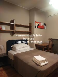 Postel nebo postele na pokoji v ubytování B&B Paolo e Francesca